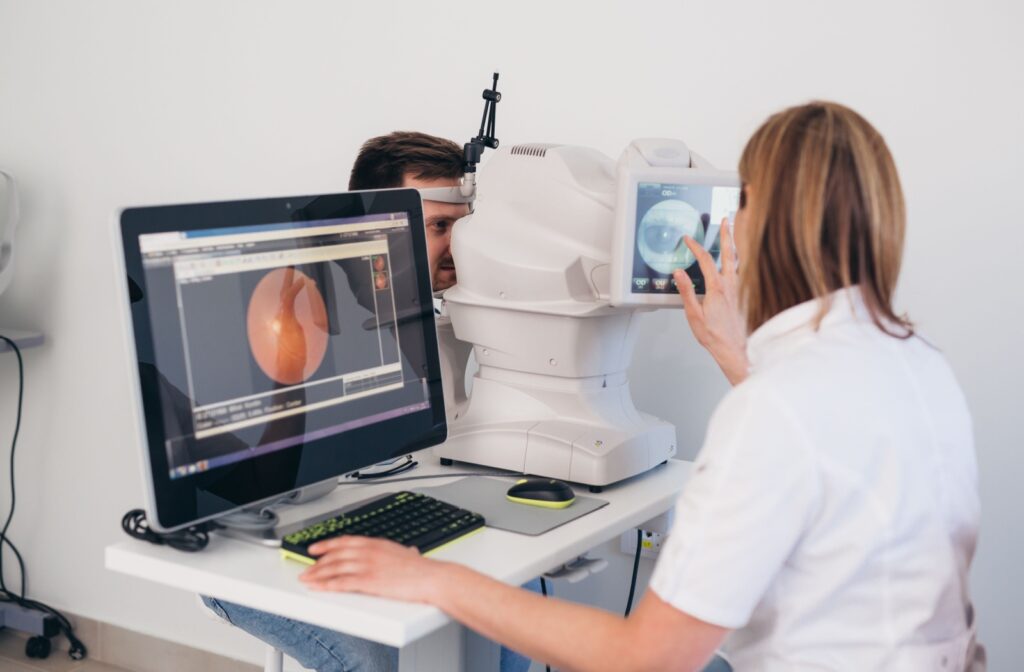 Optometrist scanning a man's retina.