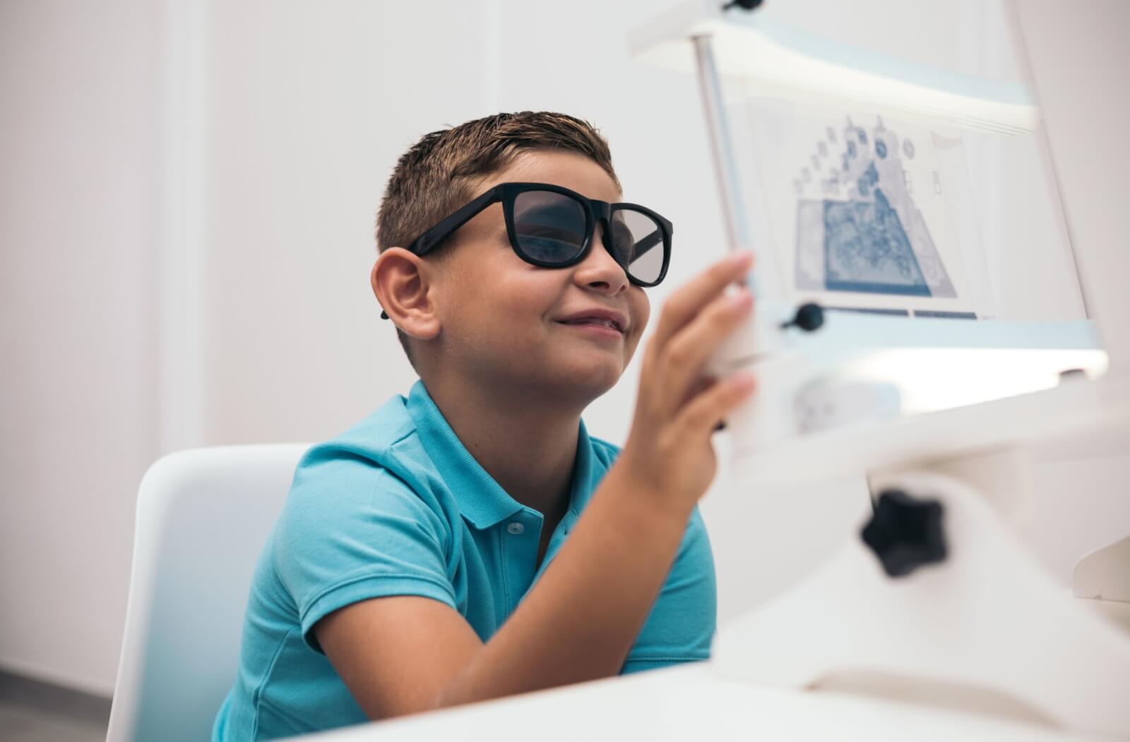 A child practices vision exercises during their vision therapy session.