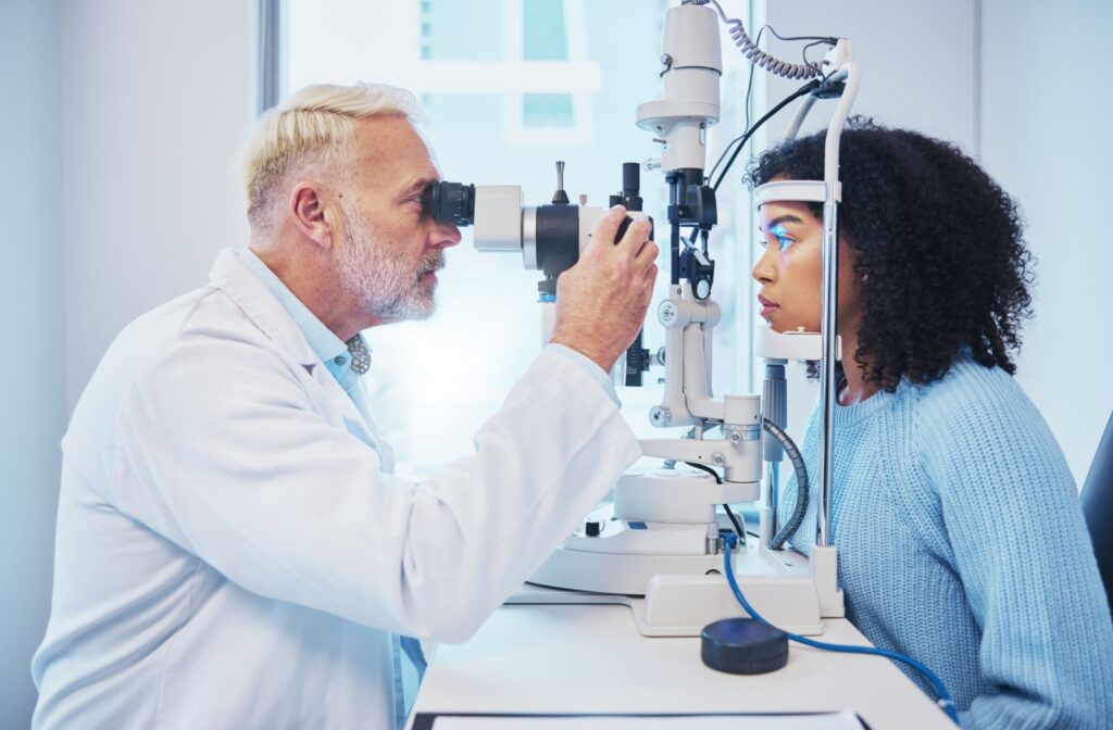 An optometrist uses a slit lamp to evaluate a patient's ocular health during an annual diabetic eye exam.