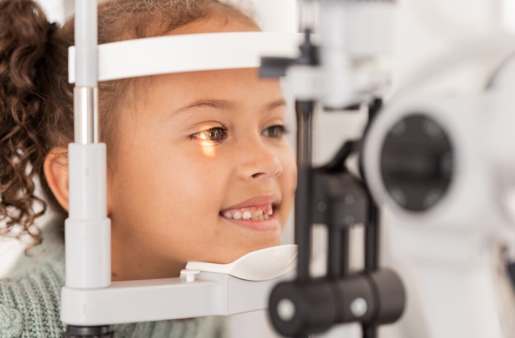 A child undergoes an eye exam to detect and treat myopia.